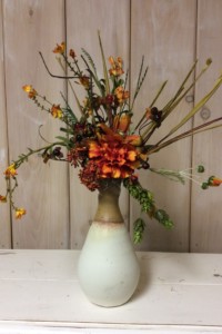 $37.  WK-407.    Fall arrangement in cream and tan hand made pottery vase