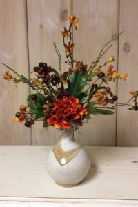 $32. WK-475   Fall arrangement in round swirl handmade pottery vase