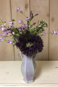 $35.  WK-497Lavender vase with purple Mums, purple Thistle, and lavender wildflowers