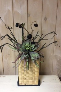 $150. WK-Aa.  Tall upright basket with large blossom and pumpkin stems